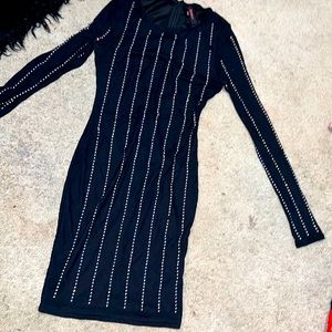 Black mini bodycon dress with rhinestones on front and back. Worn once.